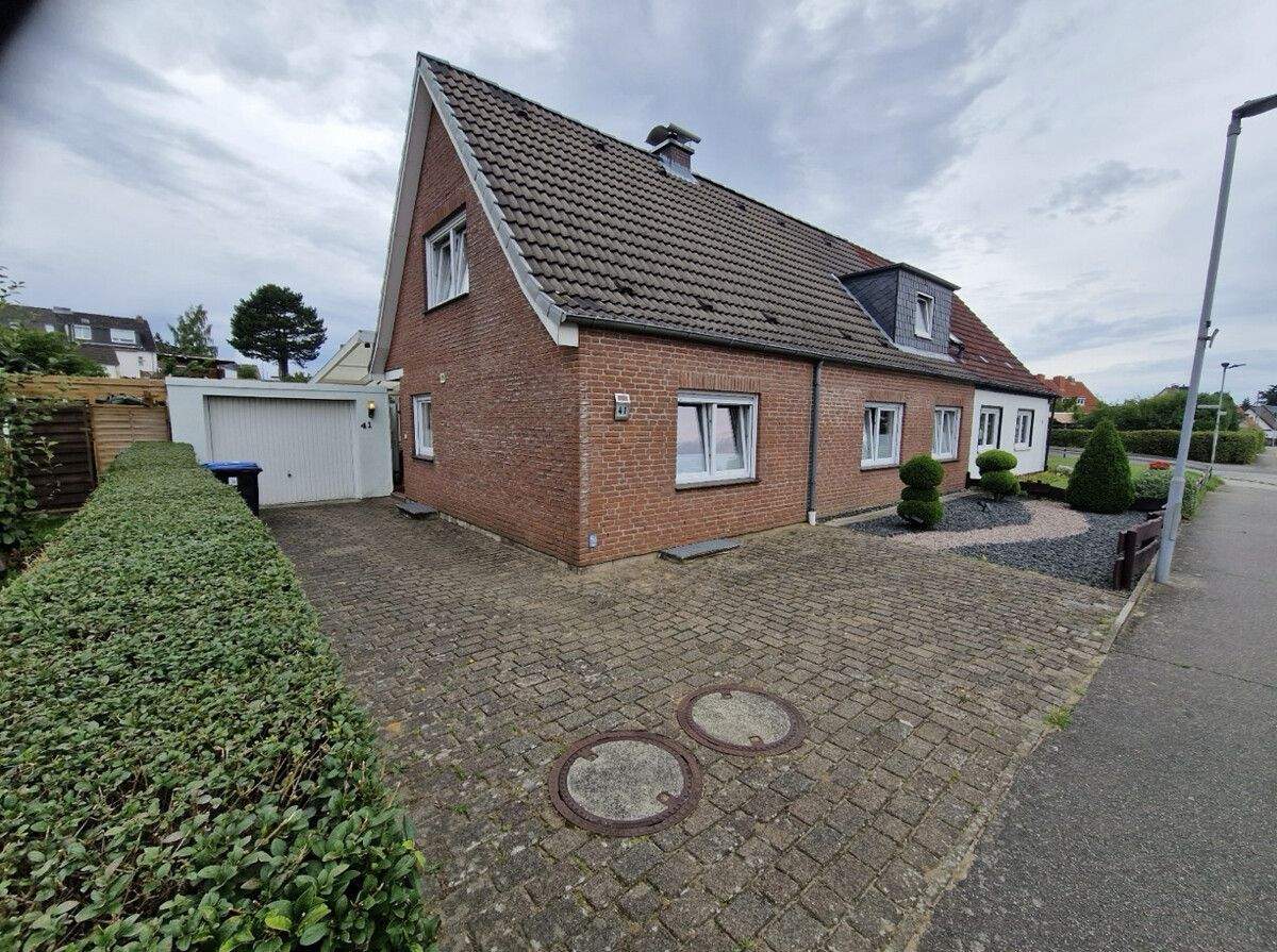 Charmante Doppelhaushälfte mit Traumgarten, großer Terrasse und moderner Ausstattung! – Lübeck – Vorschaubild 3