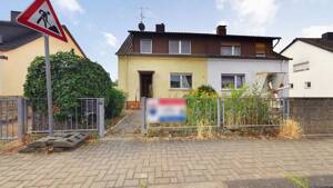 Doppelhaushälfte zurückgesetzt in einen Rohbau auf schönem Grundstück *Verkauf im Bieterverfahren* – 55246 Wiesbaden – Vorschaubild 1