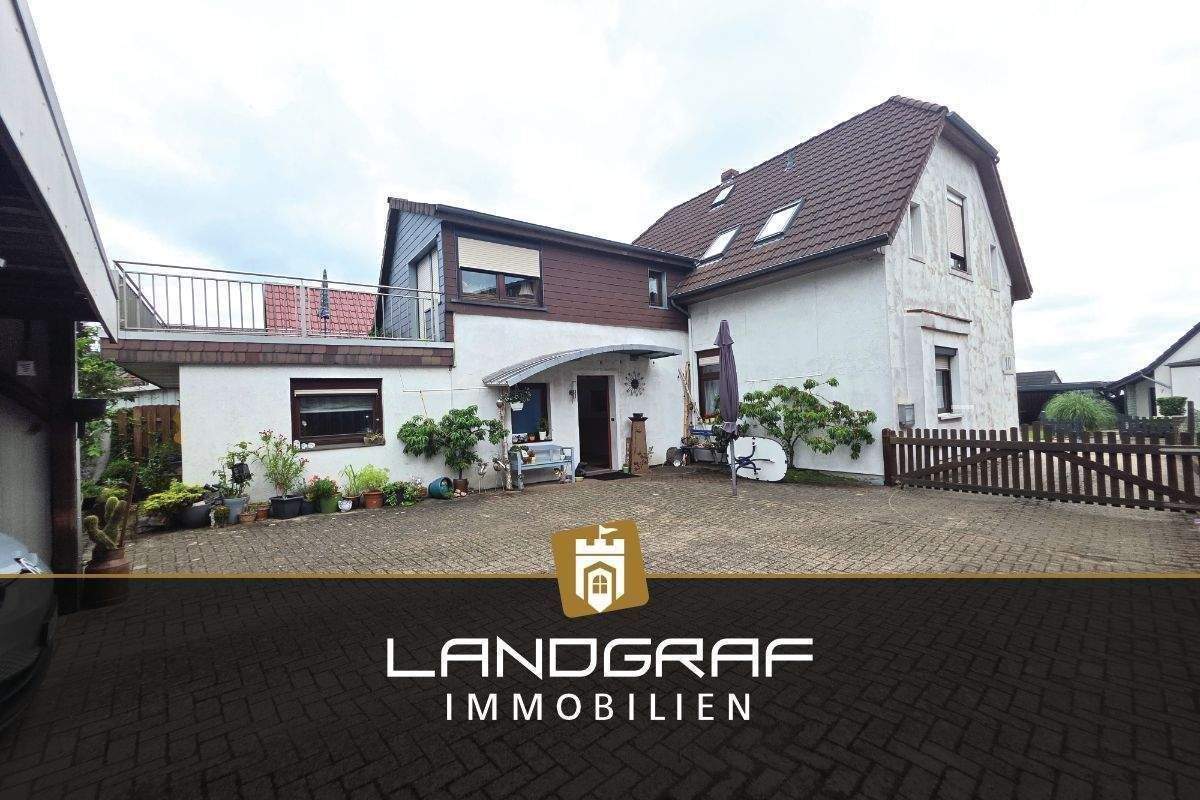 Mehr als nur ein Einfamilienhaus – Großes Grundstück mit Extra-Gartenhaus & vielseitigen Nutzungsmöglichkeiten! – Ritterhude – Bild 1 von 9