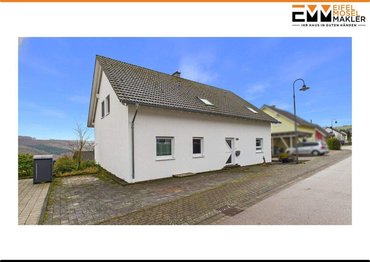 Vielseitiges Zweifamilienhaus mit Weitblick in ruhiger Lage – Lampaden – Bild 1 von 9