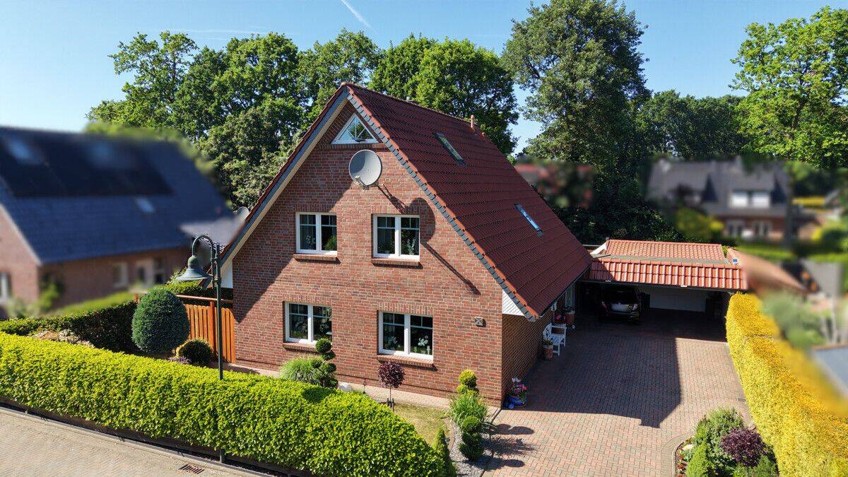Familienfreundliches Einfamilienhaus mit schönem Garten und Doppelcarport in Metjendorf – Wiefelstede – Bild 1 von 9