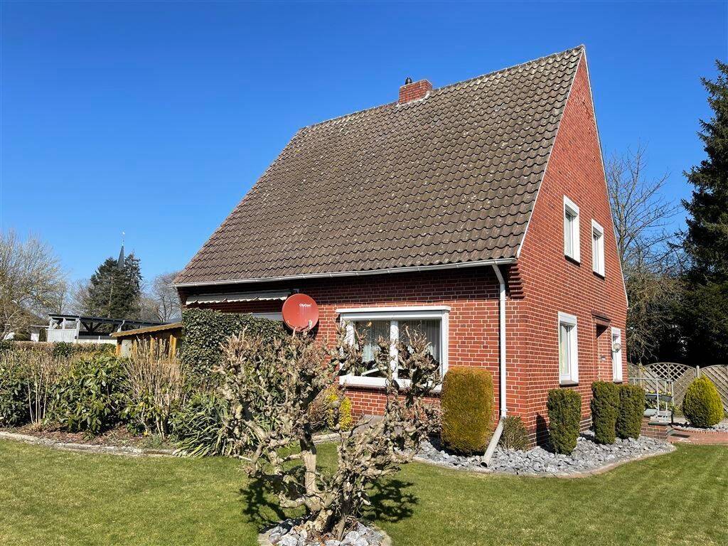 Ansprechendes Wohnhaus in ruhiger Nebenstraße -- 4 Zimmer, gepflegter Garten und Doppel-Garage! – Twistringen – Bild 1 von 9