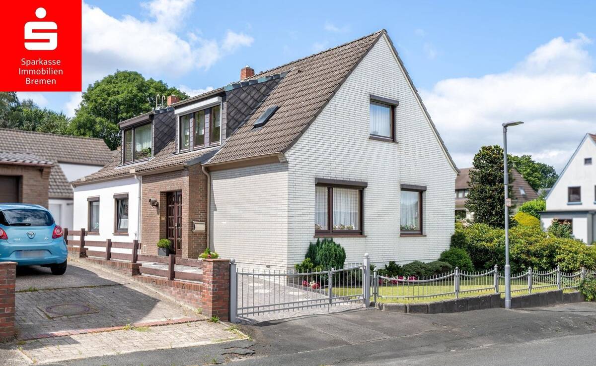 Schönebeck: Freistehendes Einfamilienhaus mit Einliegerwohnung, Nebengebäude, Garage und Garten – 28757 Bremen – Bild 1 von 9