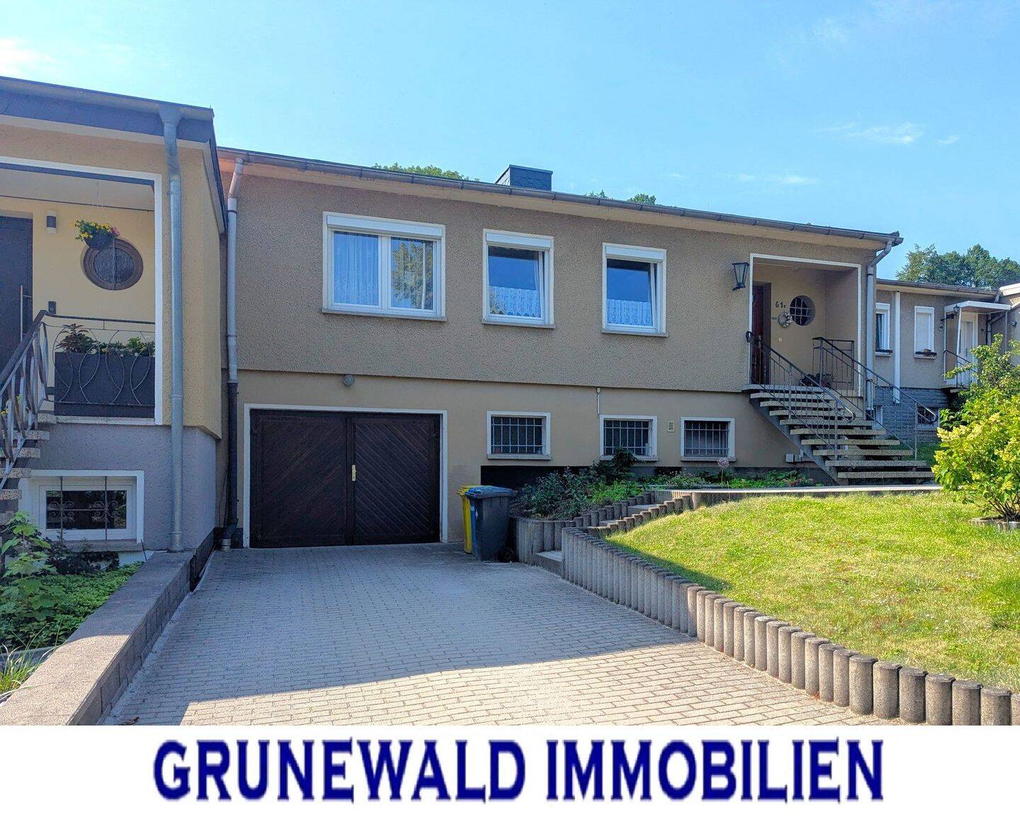 Reihenmittelhaus mit Garage, Hobbyraum und Südterrasse.