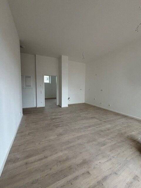 Erstbezug Lichtdurchflutete und geräumige 2-Zimmer-Wohnung mit Terrasse und Gartenanteil