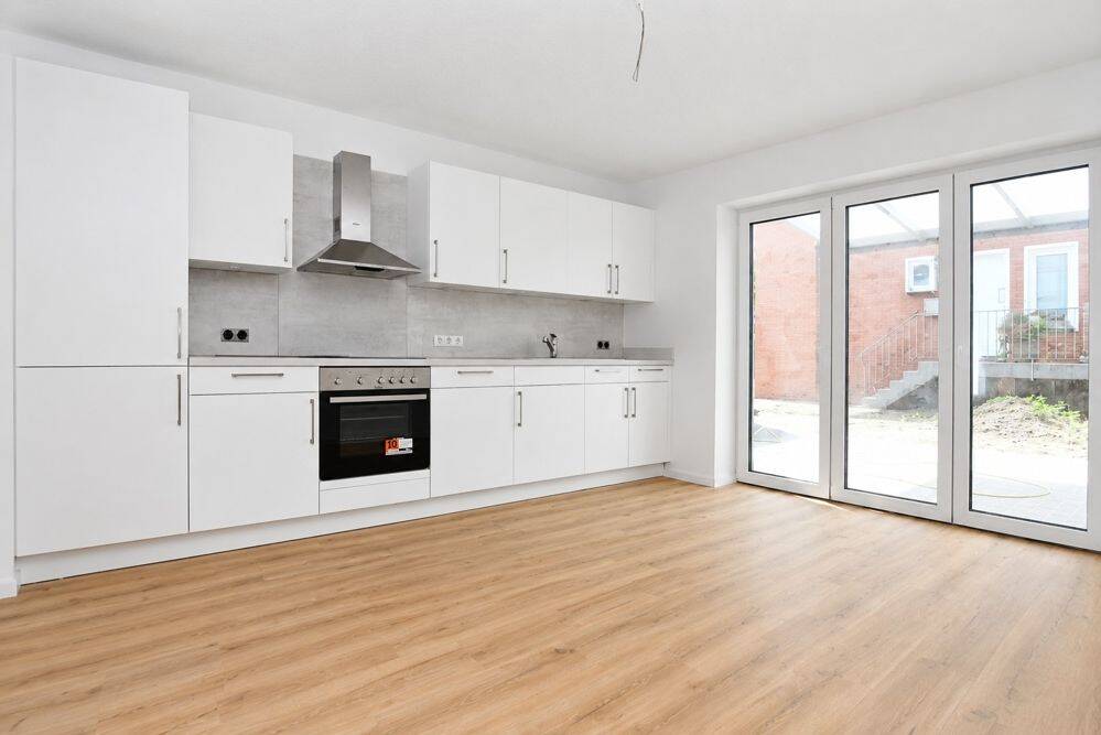 Erstbezug - Barrierefreie Neubauwohnung mit Einbauküche, überdachter Terrasse und PKW-Stellplatz in Altenoythe
