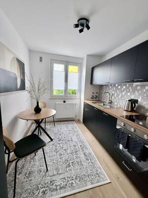 Erstbezug nach umfassender Renovierung | Exklusive 2-Zimmer-Wohnung (61,26 m²) | Loggia | Aufzug | hochwertige Teilmöblierung | All-inclusive-Miete