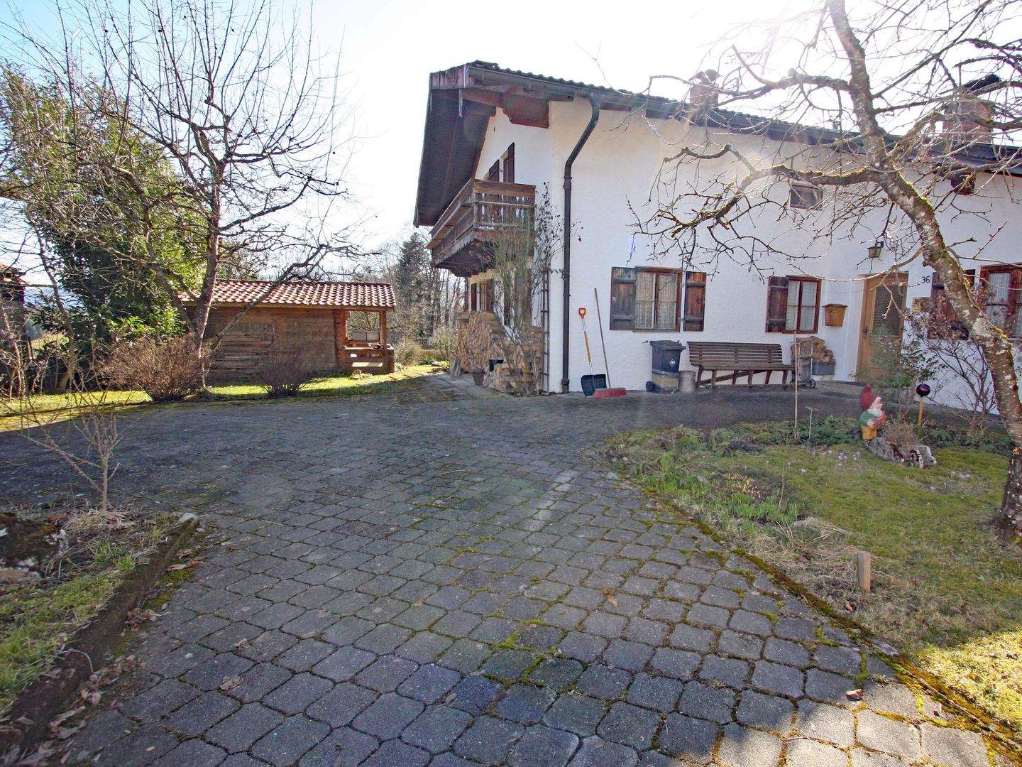 Grundstück mit Altbestand in ruhiger Ortsrandlage und schönem Alpenpanoramablick – Rimsting – Bild 1 von 9