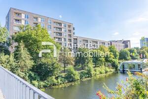 Neuwertiges Apartment am Mittelkanal und fußläufig zur S-Bahn mit Tiefgaragenstellplatz