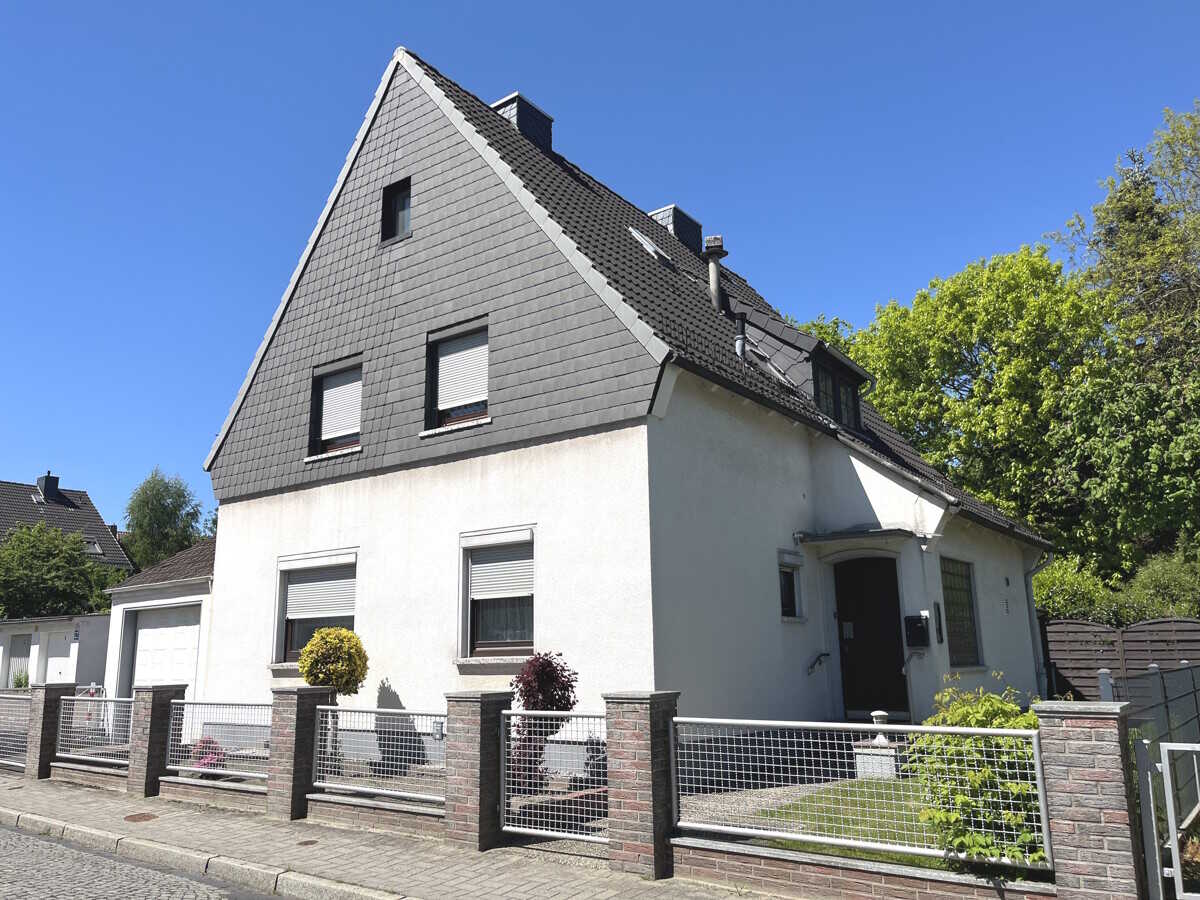 PURNHAGEN-IMMOBILIEN - Freistehendes 1-Fam.-Haus mit Garage in ruhiger und grüner Wohnlage!