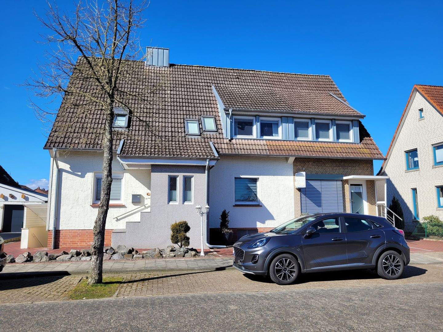 Einfamilienhaus mit 2 lukrativen Gewerbeeinheiten! – Diepholz – Bild 1 von 9