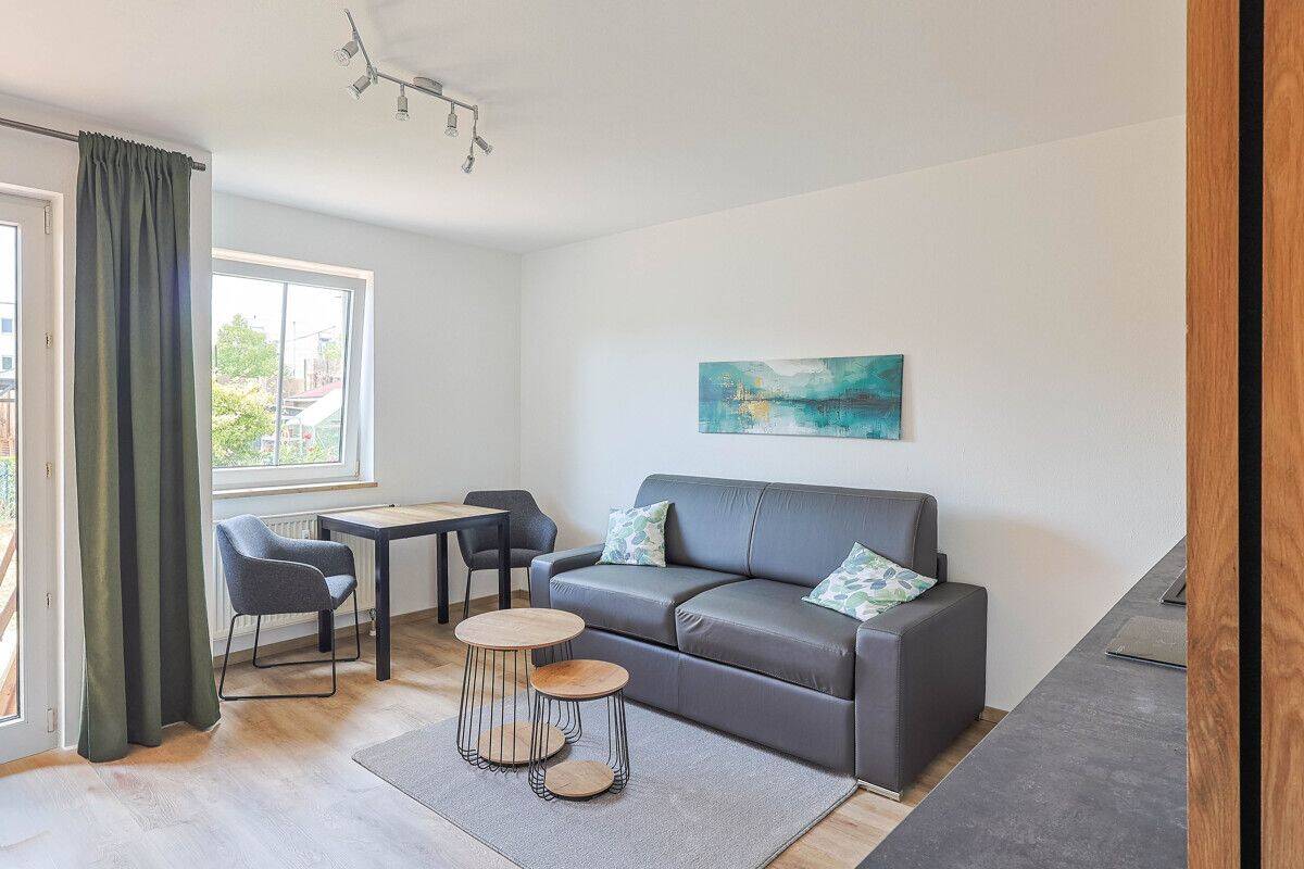 Möblierte 1-Zimmer-Wohnung mit privatem Gartenanteil